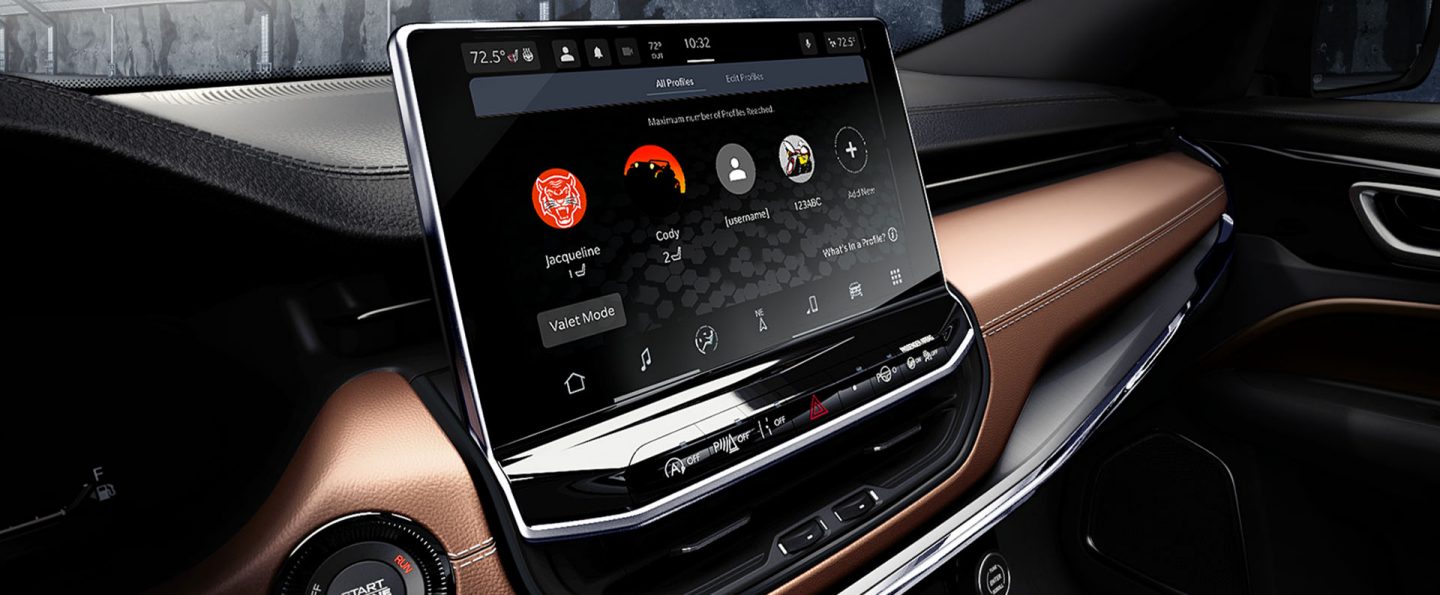 The Uconnect touchscreen in the 2025 Jeep Compass Limited displaying the passengers' smartphones that are currently connected to the system.