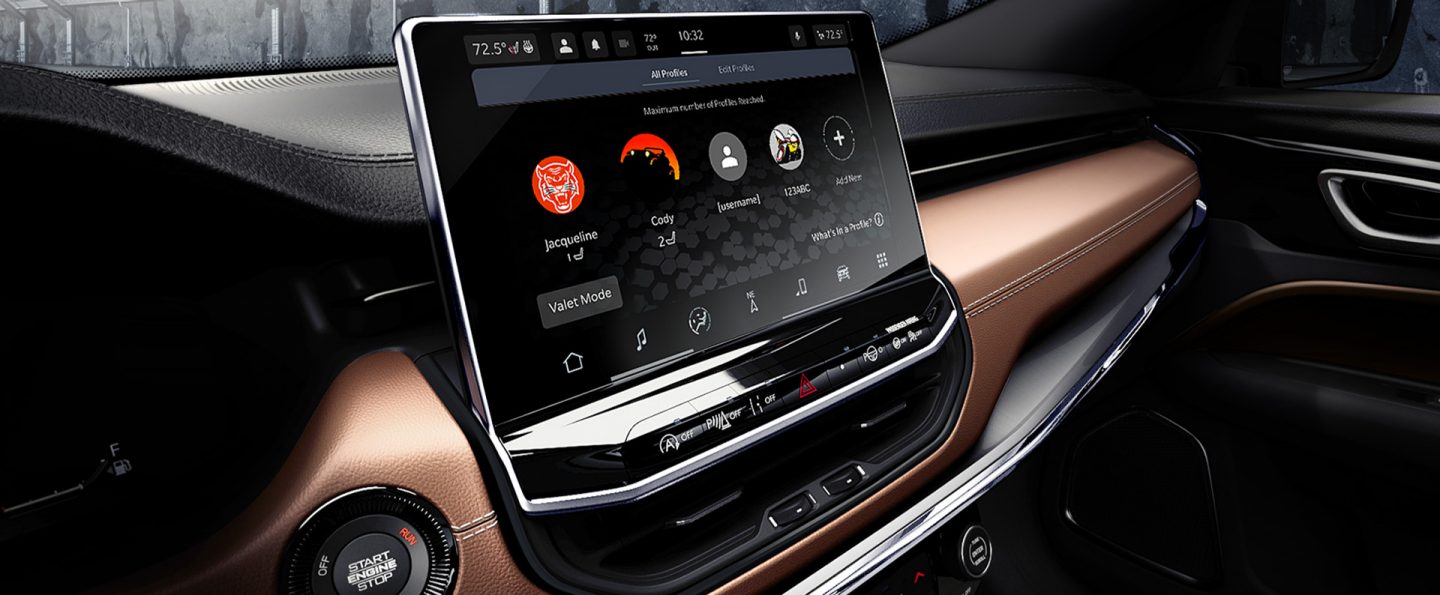 The Uconnect touchscreen in the 2025 Jeep Compass Limited displaying the passengers' smartphones that are currently connected to the system.