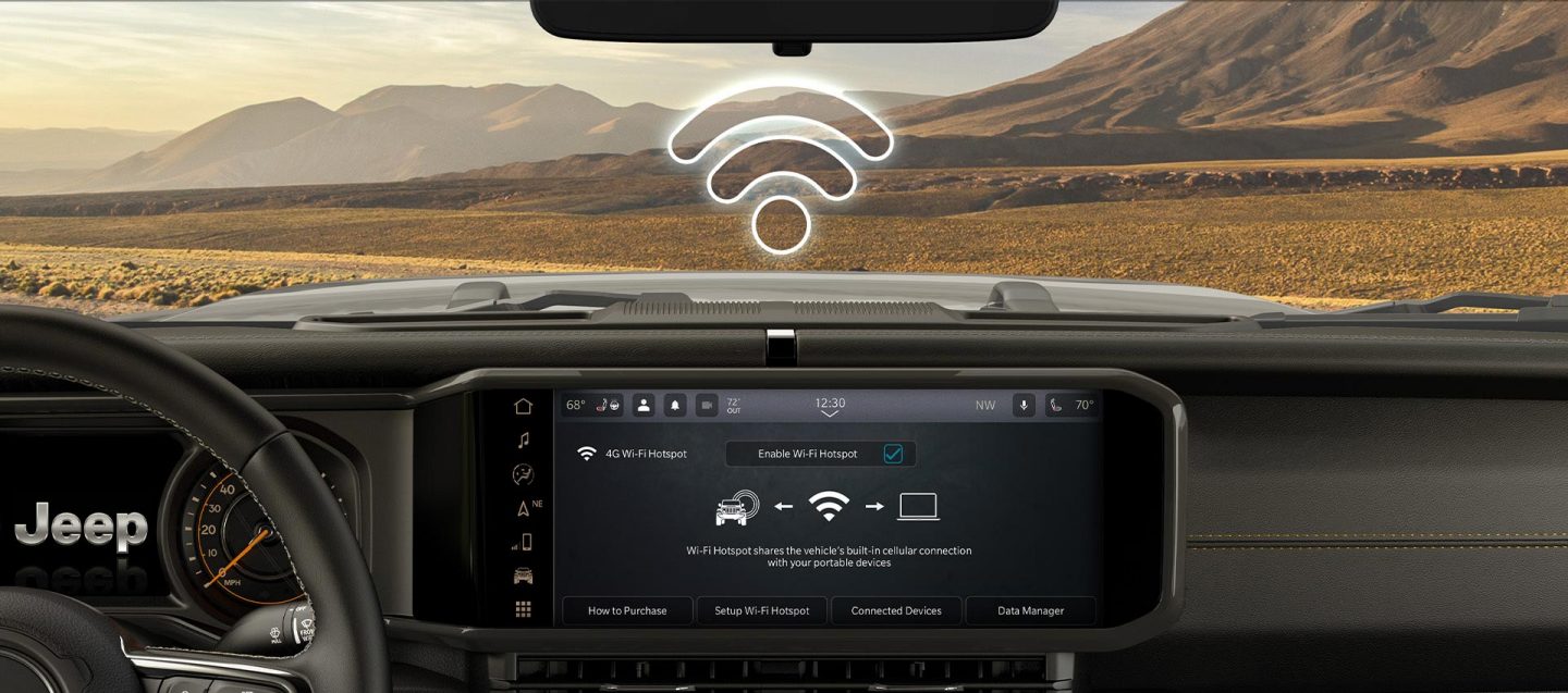 A close-up of the Uconnect touchscreen in the 2025 Jeep Wrangler displaying the Wi-Fi Hotspot connection.