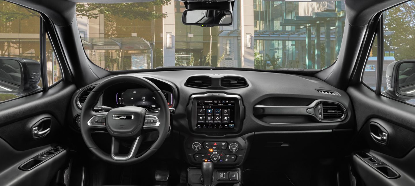 The steering wheel. touchscreen, center console and dashboard in the 2025 Jeep Renegade.